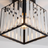 Close up of the Arlo faceted crystal prisms and black metal frame