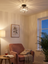 Arlo crystal ceiling light sparkling above a bedroom reading corner at dusk