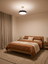 Halo ceiling light giving soft even light in a bedroom in the evening