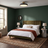 Halo black and brass ceiling light in a green hotel style bedroom