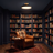 Halo ceiling light glowing in a navy home library at night